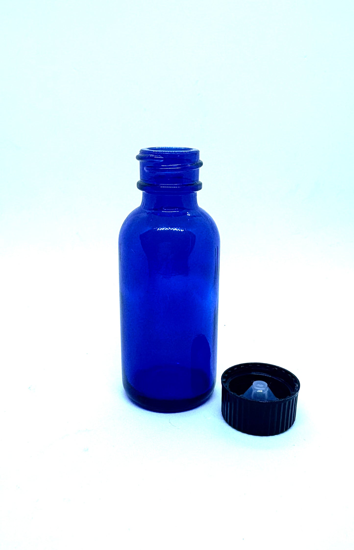 One 30 ml / 1 oz Blue Glass Bottle with cone lined cap
